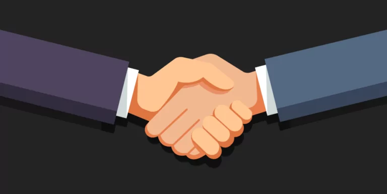 Aperto de mãos para simbolizar a associação da DTCOM à ACATE